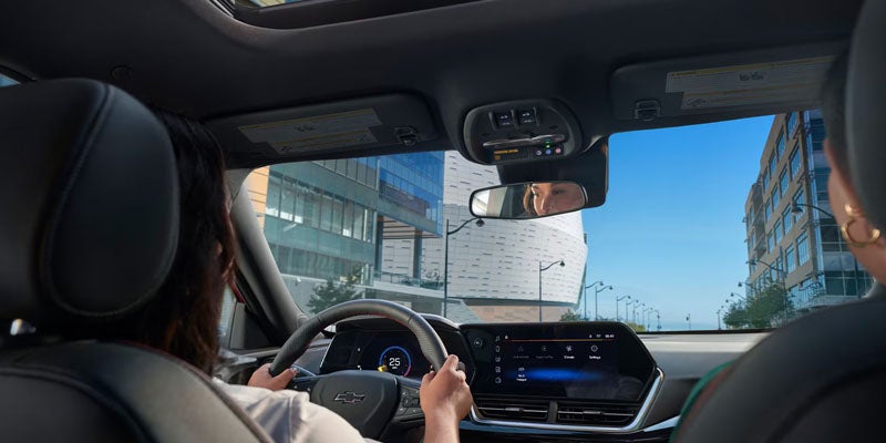 Woman driving in a 2026 Chevrolet Trax near East Tawas, MD