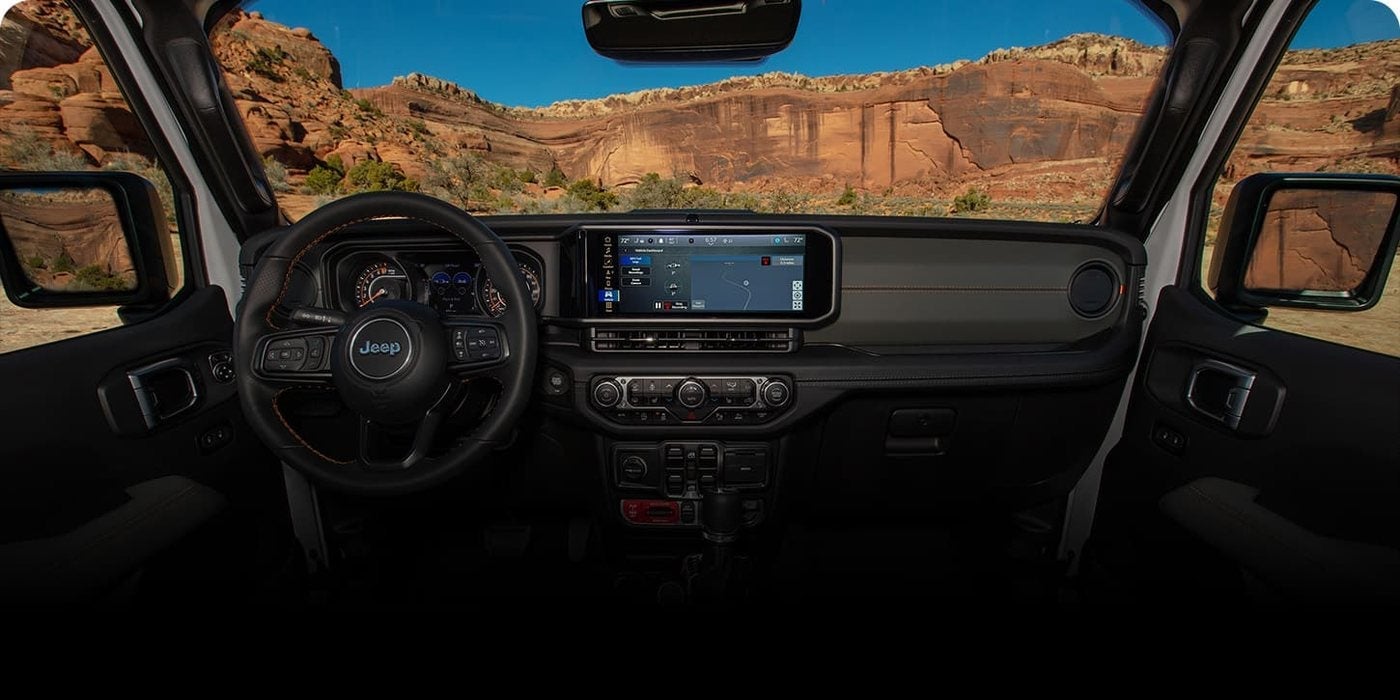 Dashboard of a 2026 Jeep Gladiator Rubicon X with the 12.3-inch Uconnect touchscreen, at Ross Downing CDJR in Hammond, LA