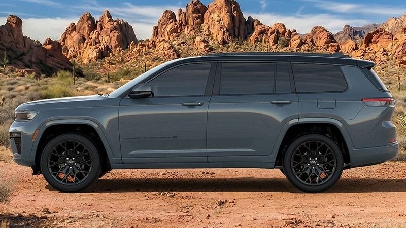 Gray 2027 Jeep Grand Cherokee L in profile in a red-rock desert; Jeep offers at Ross Downing CDJR in Hammond, LA