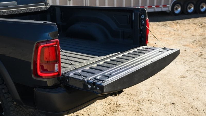 2027 Ram 2500 Rebel with its tailgate down beside a trailer; trade in your vehicle at Ross Downing CDJR in Hammond, LA