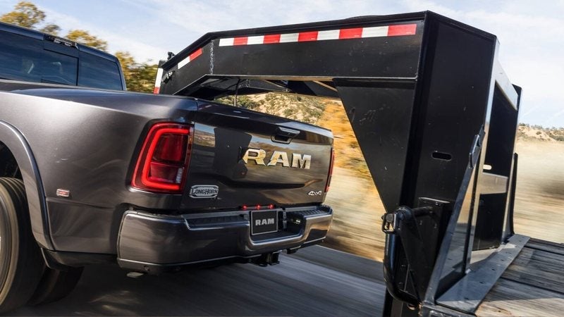 2027 Ram 3500 dually hitched to a gooseneck trailer; trade in your vehicle at Ross Downing CDJR in Hammond, LA