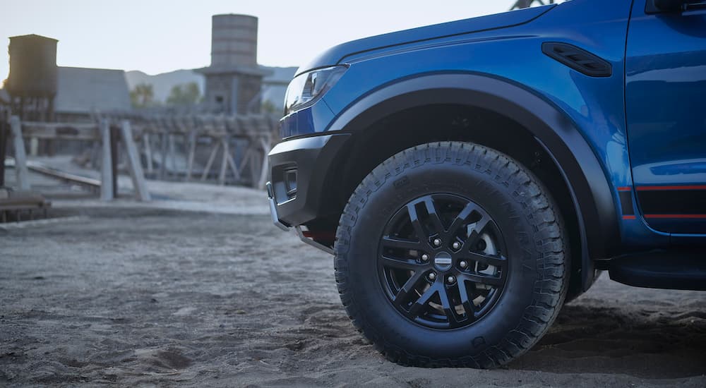 Close-up on the wheel of a blue 2023 Ford Ranger Raptor.