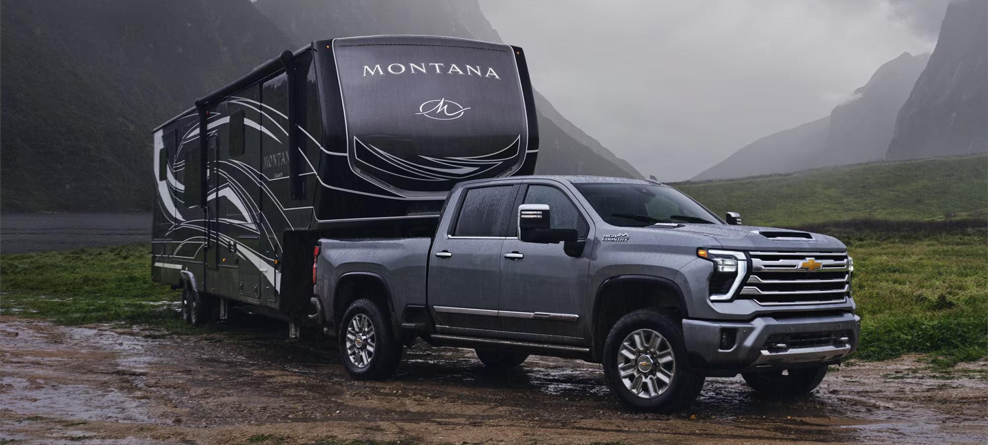 2025 Chevy Silverado 2500 HD truck towing a camper