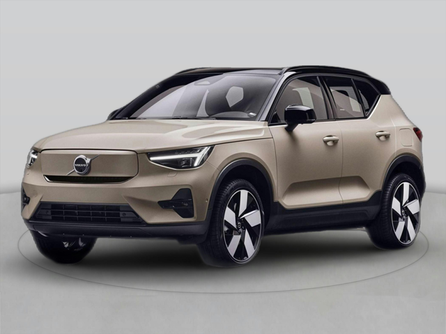 A beige 2025 Volvo EX40 Core electric SUV with black trim and stylish wheels on a light background.