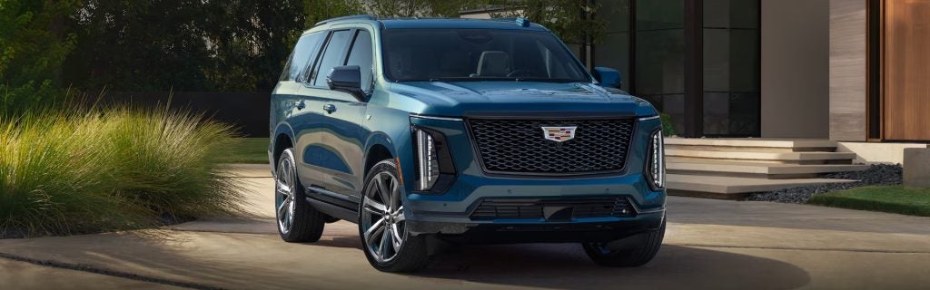 Cadillac SUV parked in driveway
