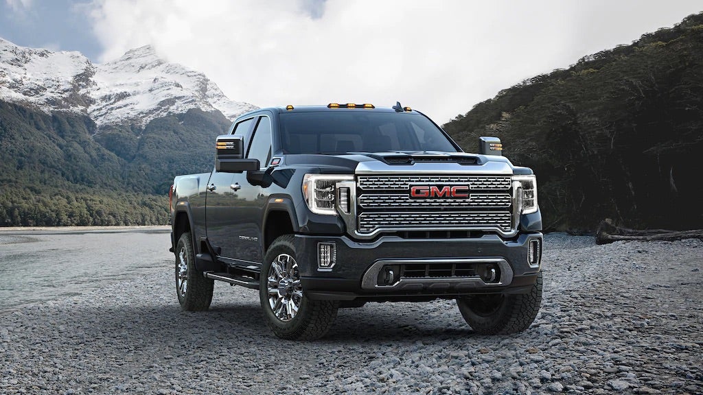 GMC Truck in front of mountains