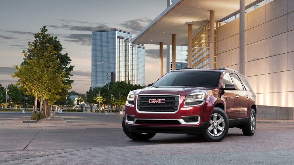 GMC SUV in front of building