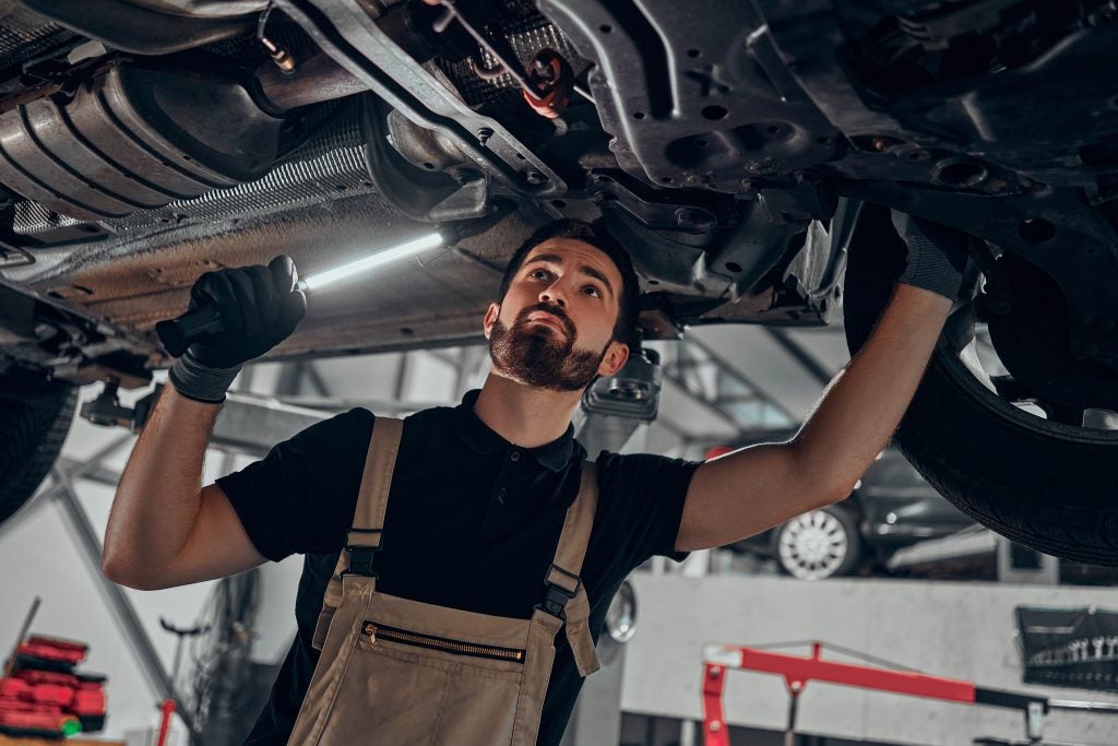 Service Tech under a car