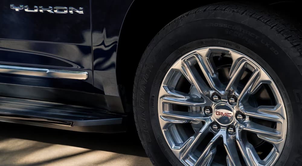 Close-up of a wheel on a black 2024 GMC Yukon.