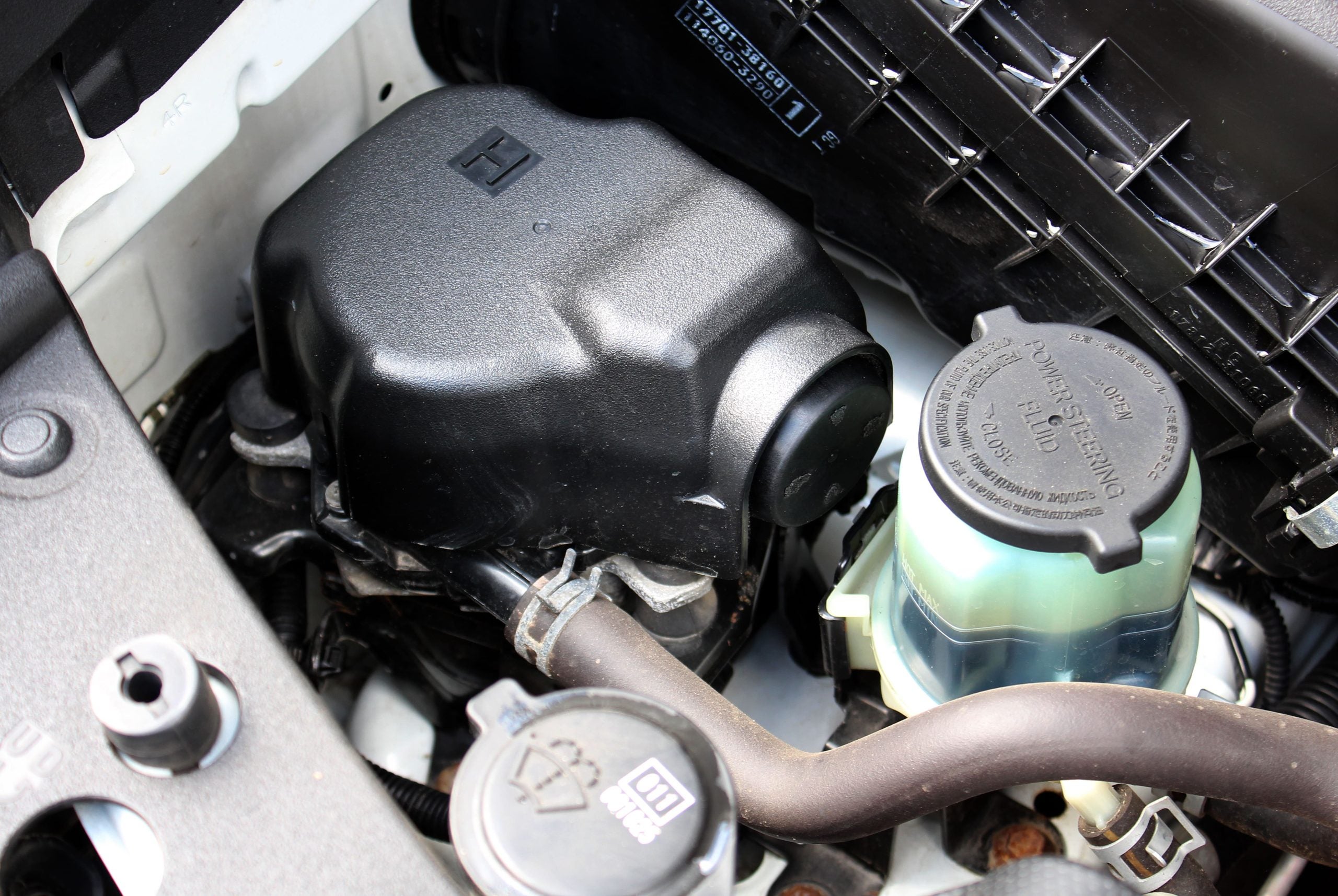Power steering fluid in an engine