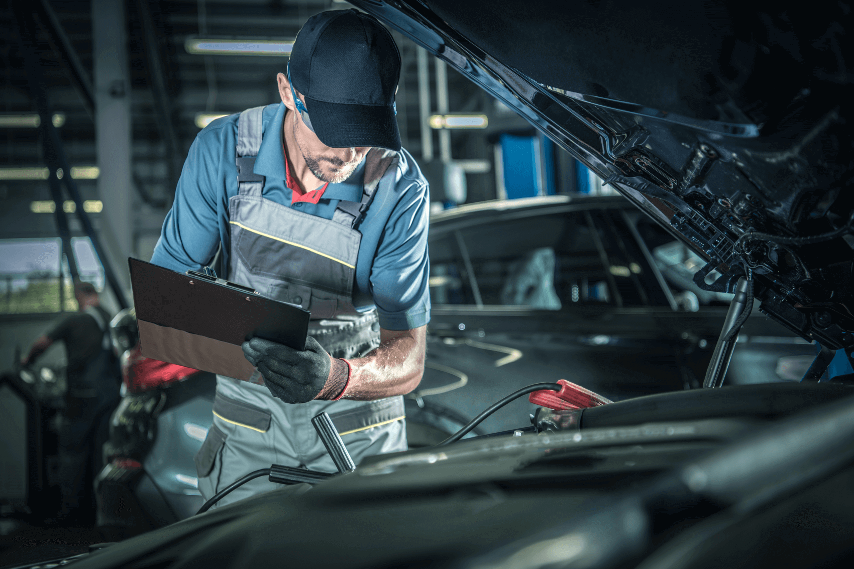 Service technician working on a used car in Odessa, TX