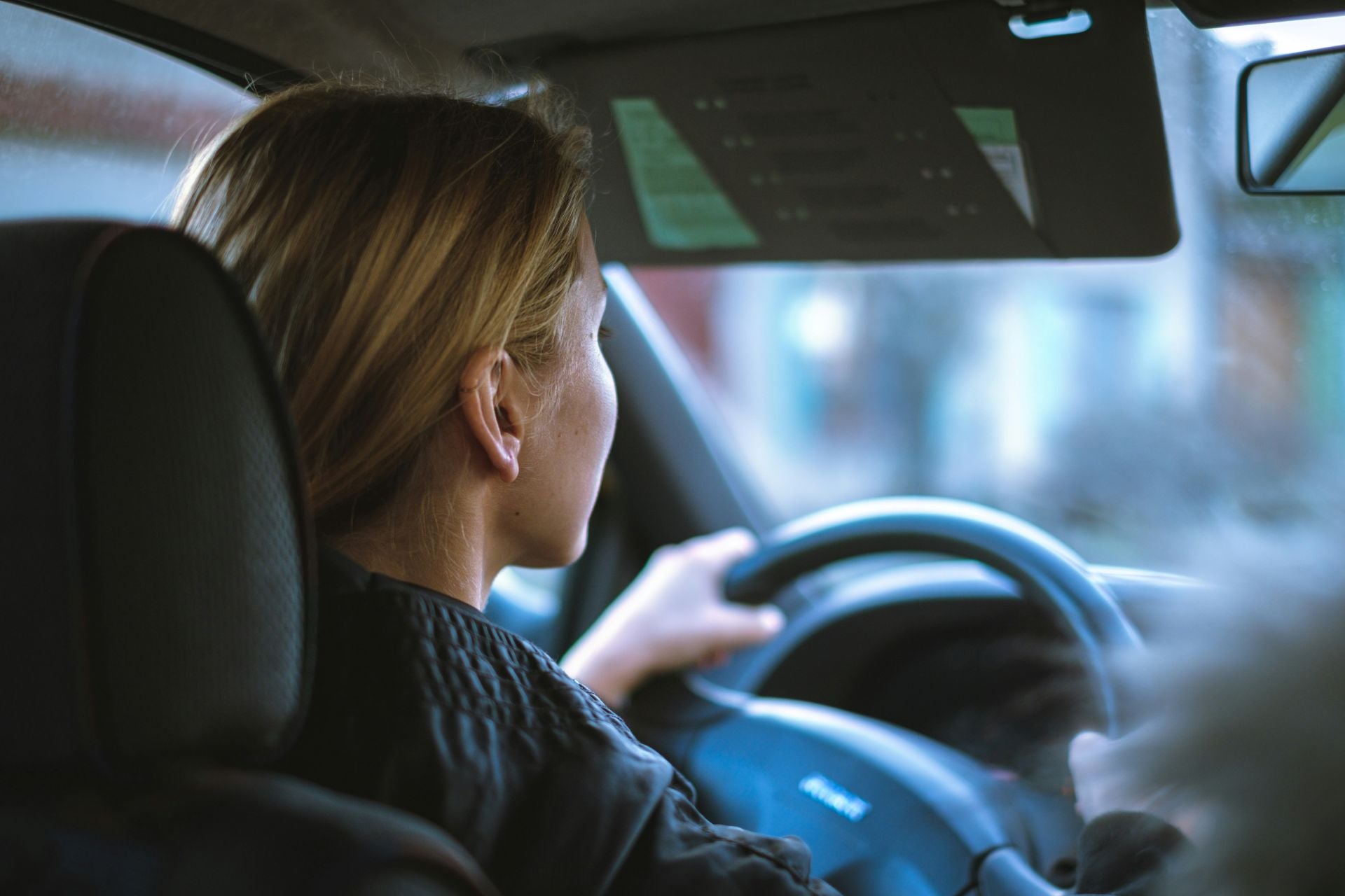 Female teenage driver behind the wheel