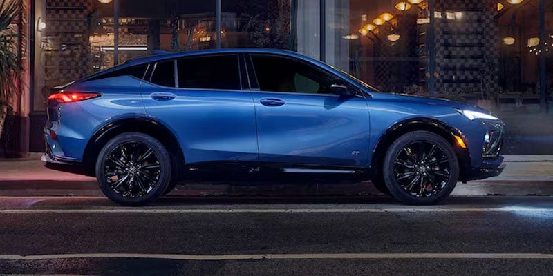Blue 2026 Buick Envision driving down a road in Poughkeepsie, NY