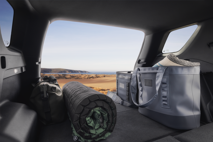 2026 GMC Terrain cargo area with camping gear loaded in the rear, highlighting SUV cargo space and outdoor lifestyle capability.