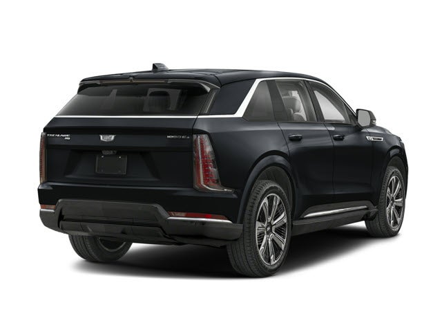 Black 2026 Cadillac Escalade IQ SUV seen from the rear, showcasing a sleek design and large wheels.