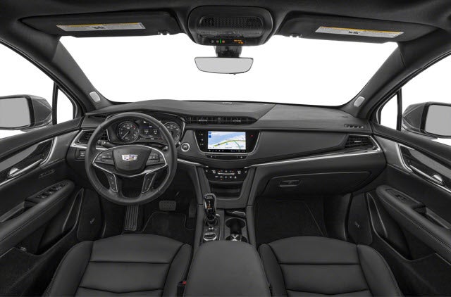 A modern 2026 Cadillac XT5 interior featuring a black leather steering wheel, dashboard with touchscreen, and comfortable seats.