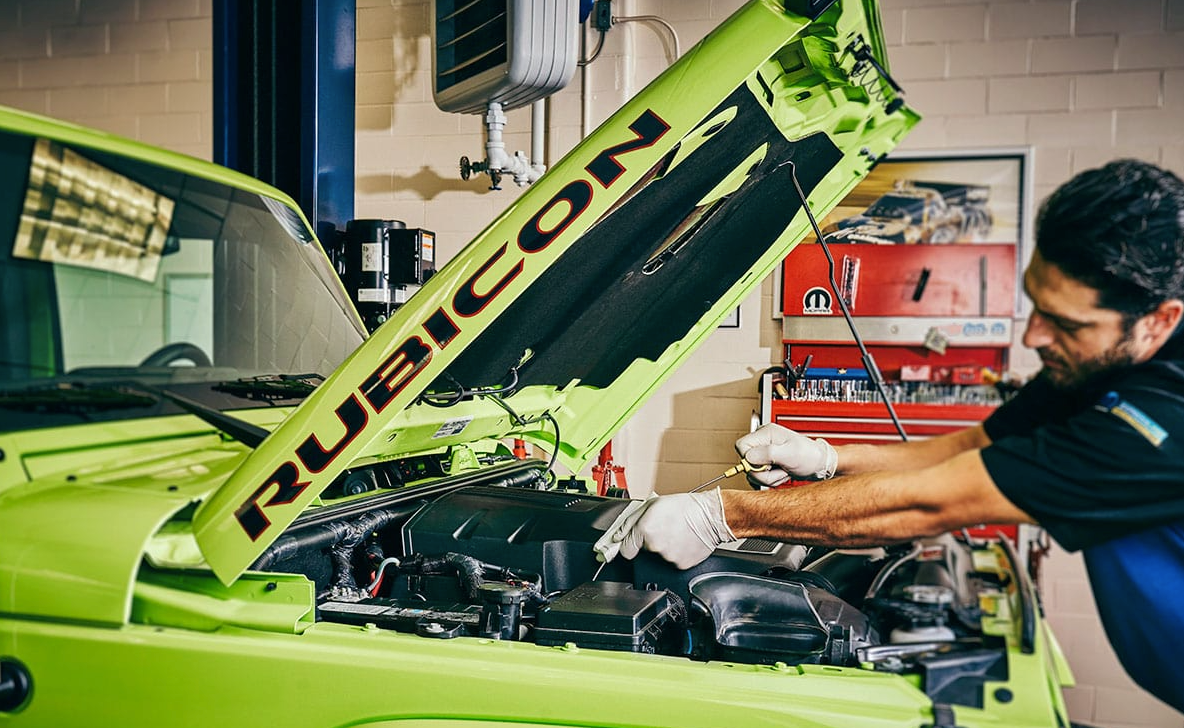 Changing oil on a Neon green Jeep Rubicon