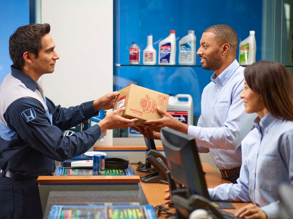 Honda service technician taking genuine Honda parts