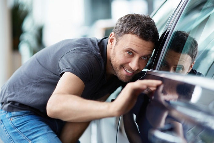 Man inspecting new Honda vehicle
