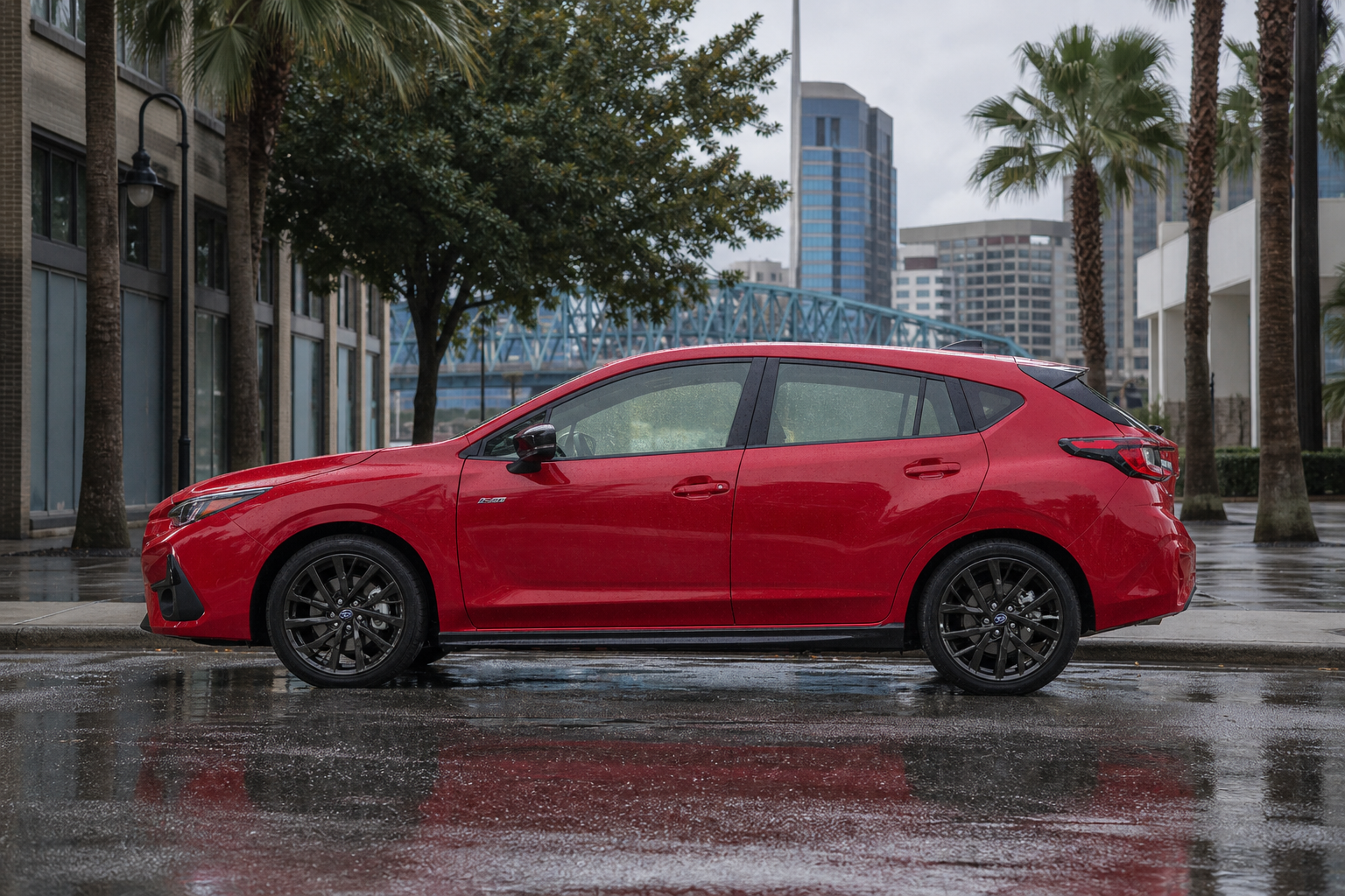 An unbadged crossover on a rain-slicked Jacksonville street corner with wet pavement reflecting a gray summer sky
