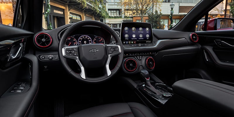 Interior view of a Chevrolet SUV, showcasing modern design, spacious seating, and advanced technology features.