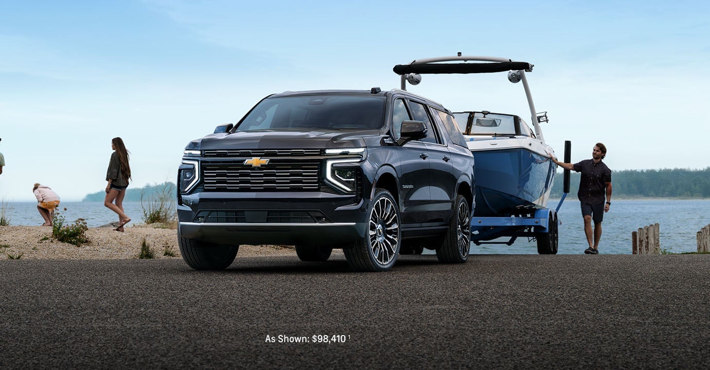 2026 Chevy Suburban dropping a boat off at the beach