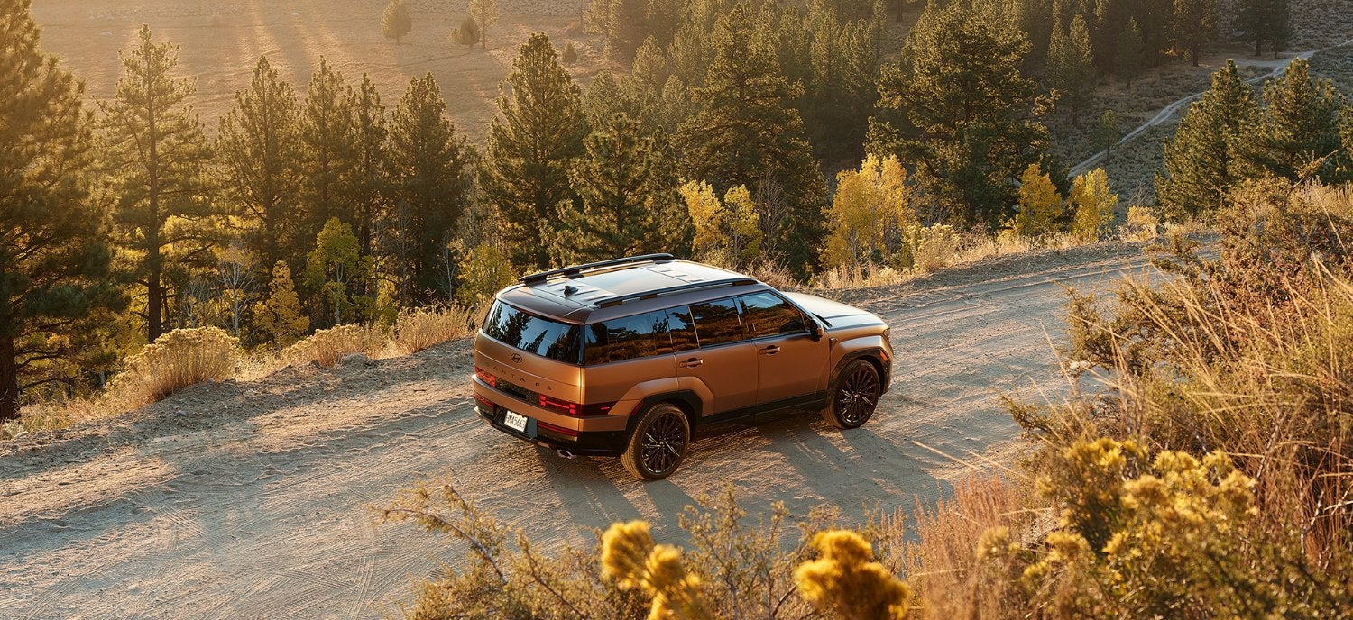 Hyundai Santa Fe SUV on a gravel mountain road