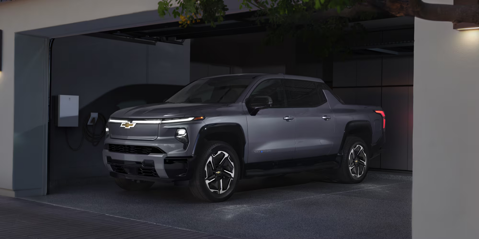 A 2026 Chevrolet Silverado EV charging at home