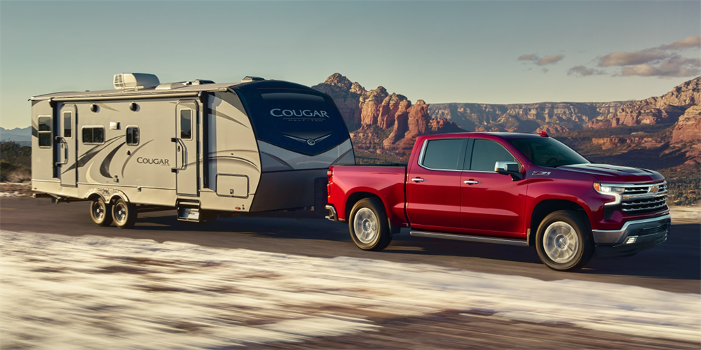 2026 Chevrolet Silverado 1500 towing a camper