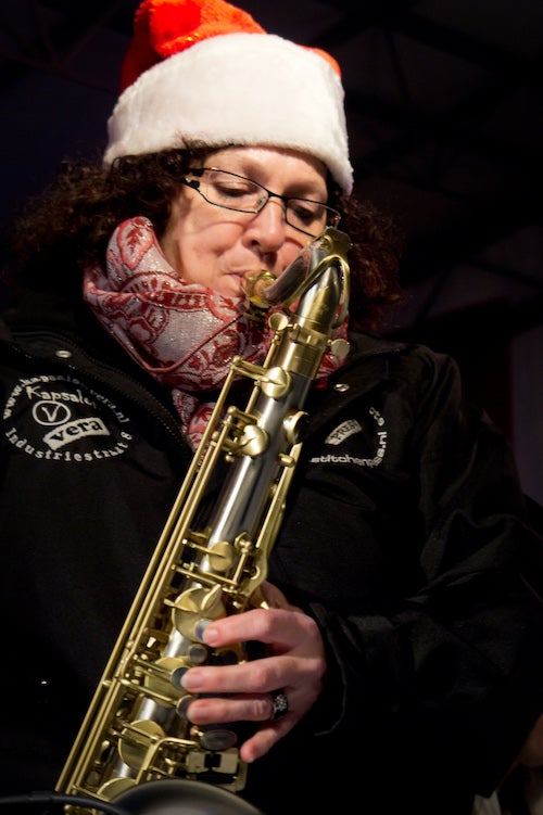 musician playing saxophone at a christmas event