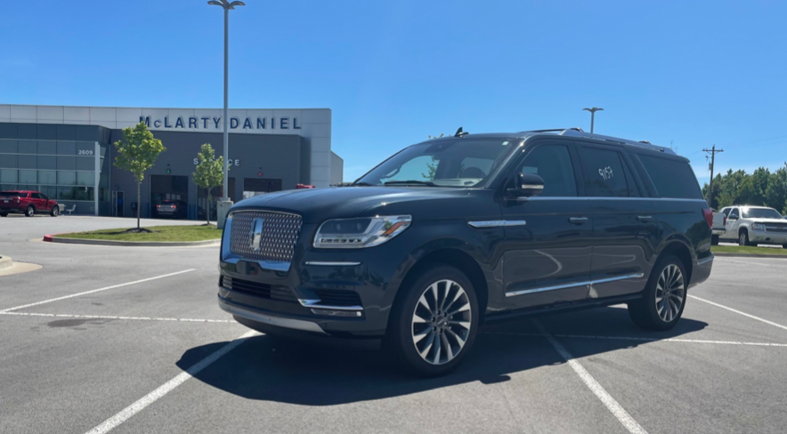 Lincoln Navigator side view in the dealership lot