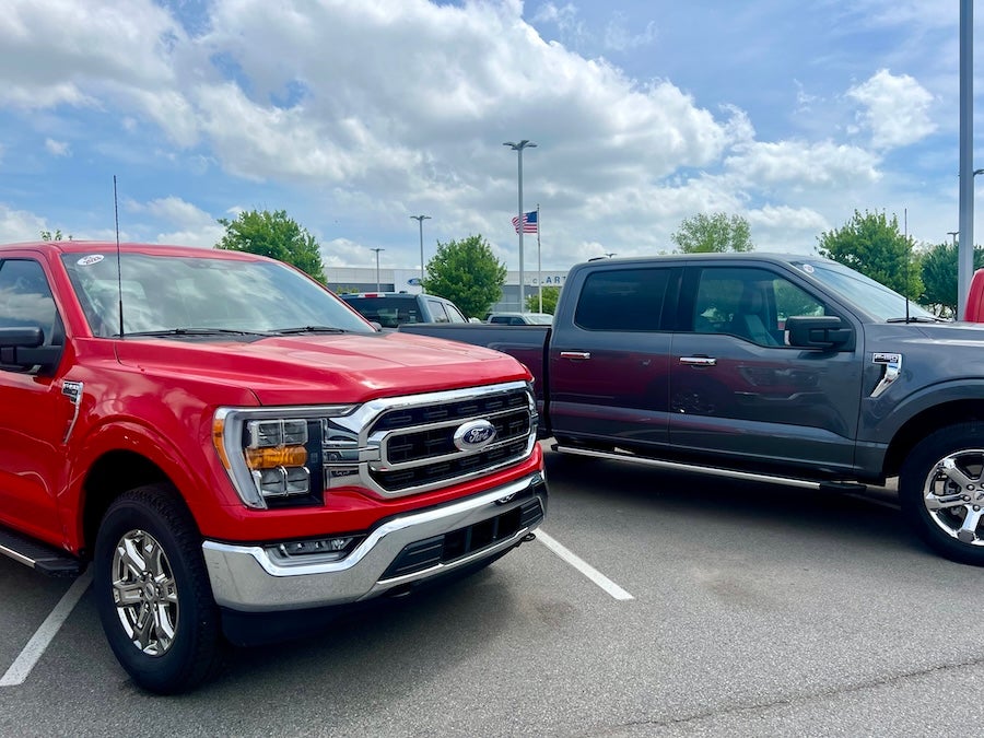Red and Blue Ford F-150 trucks