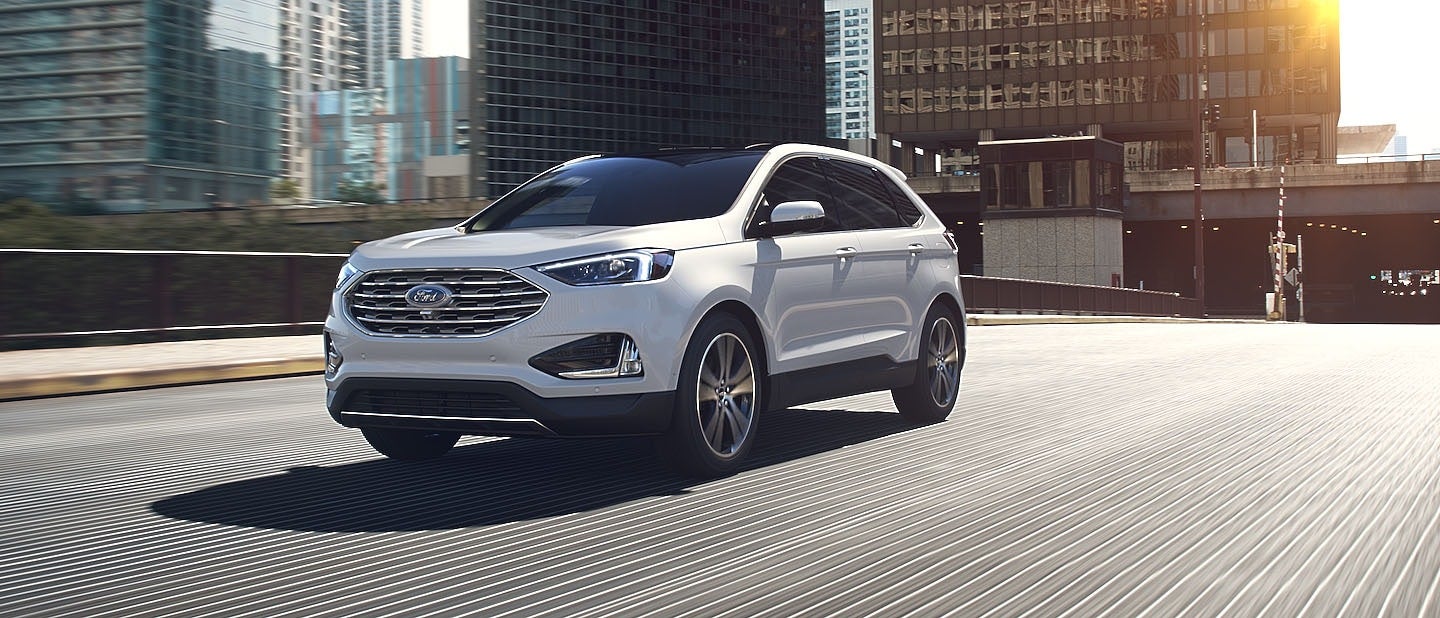 Ford Edge exiting a city on the highway