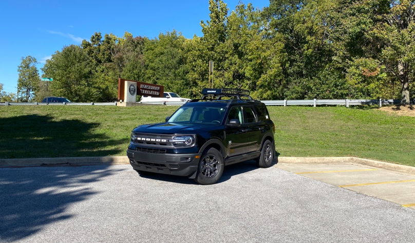 a Ford Bronco parked in the back of the dealership lot