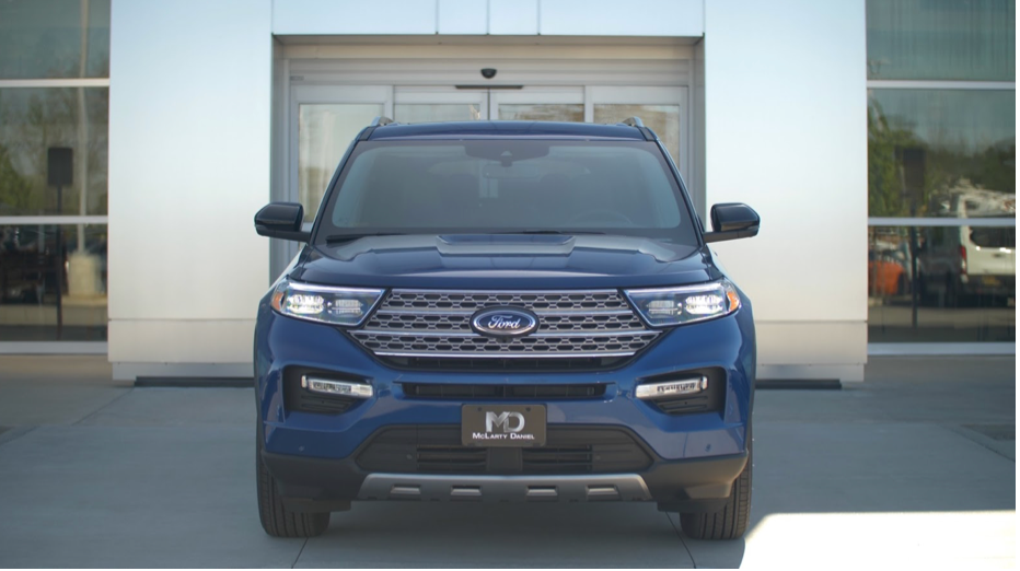 Ford Explorer front view in front of dealership building