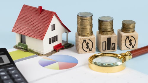 Toy house and coins