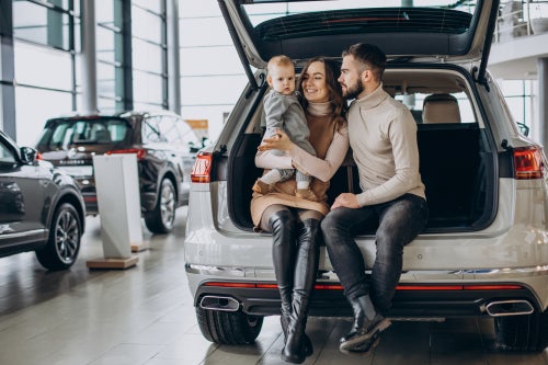 Family in front of SUV