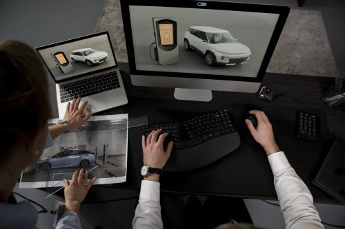 People using a laptop and computer