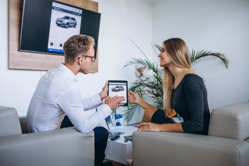 Two people looking at tablet