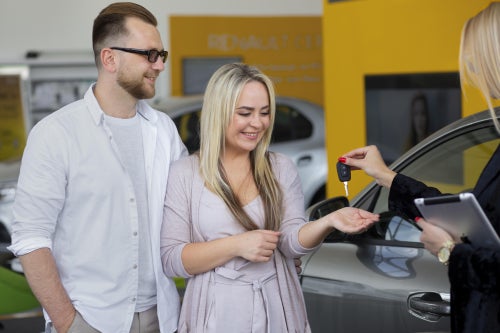Couple receiving car keys