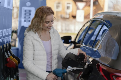 Woman getting gas