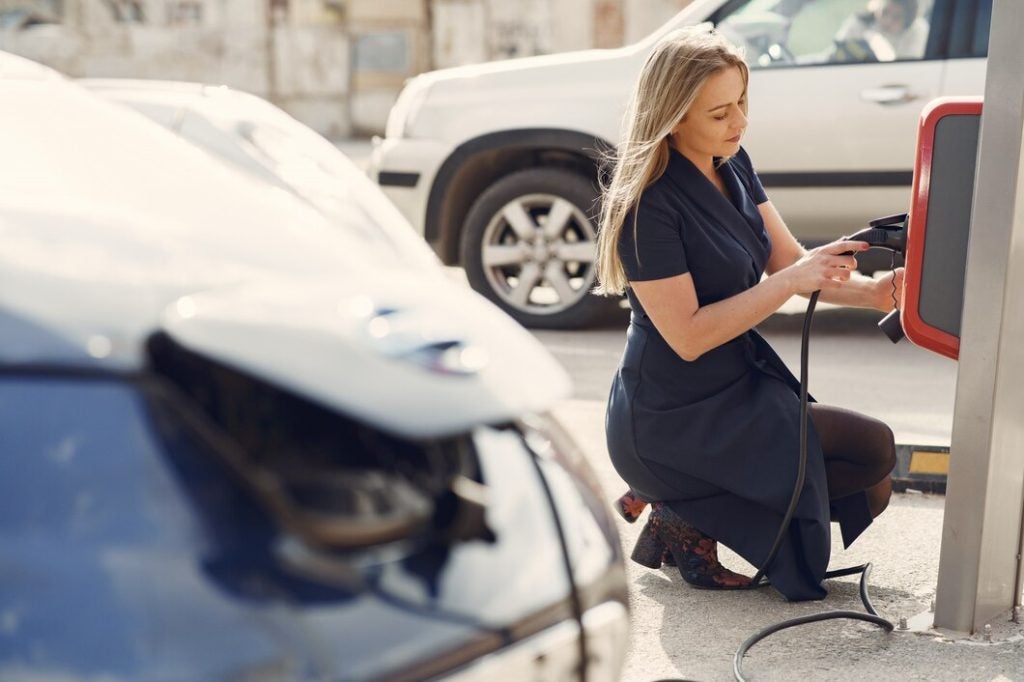 Person charging EV