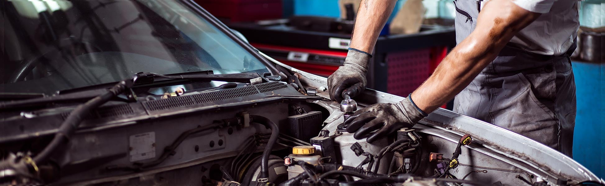 service tech working on vehicle