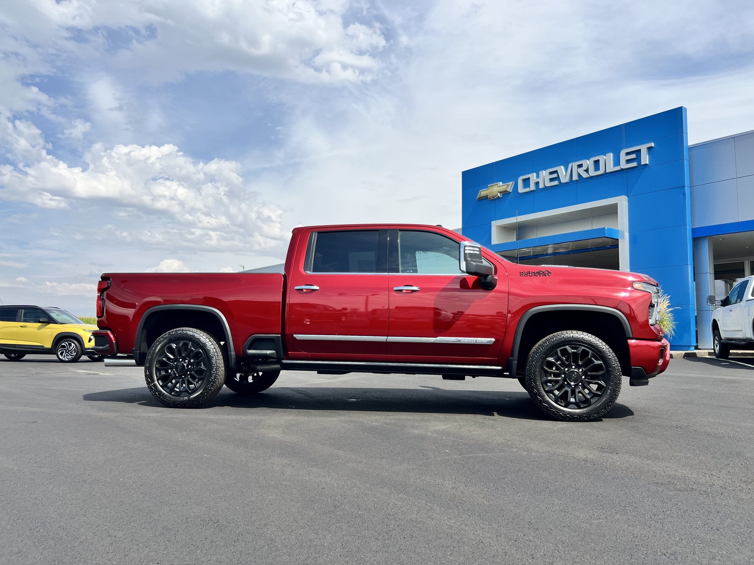 Red Chevrolet Silverado 2500 at a dealership