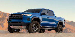 A blue 2026 Chevy Colorado from Valley Stream, NY parked on top of dry mountainous terrain.