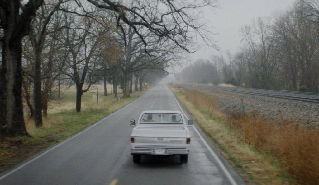 Car driving on a rural road