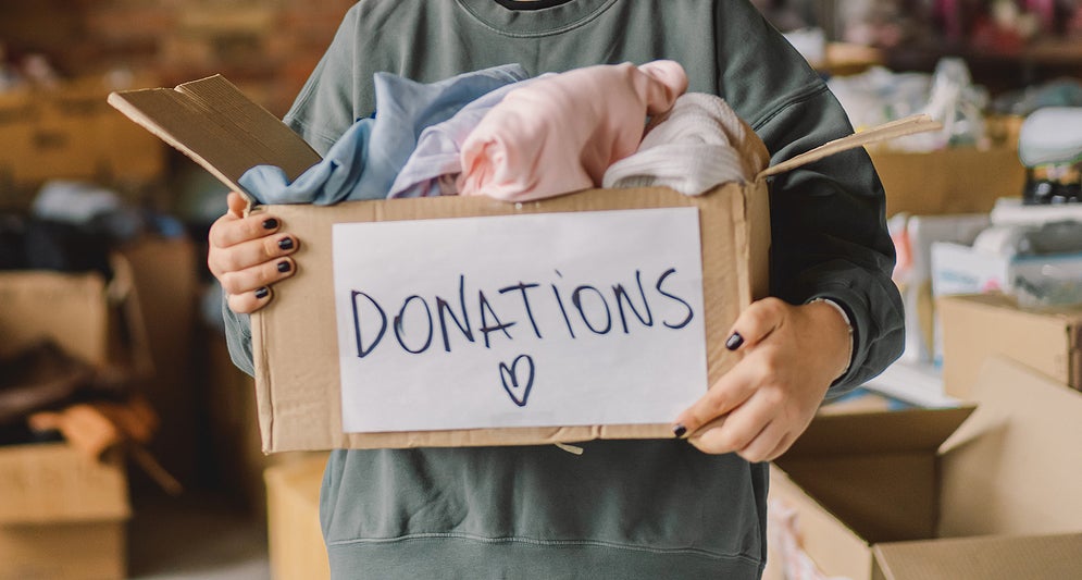 Volunteer Teengirl Preparing Donation Boxes For People. Donation
