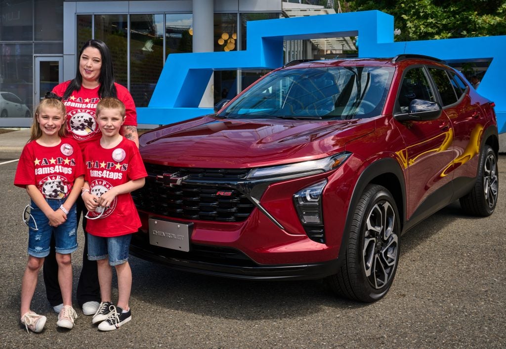 The Tinsley family standing in front of the 2024 Chevrolet Trax RS. (Photo by Stephen Brashear for Chevrolet)