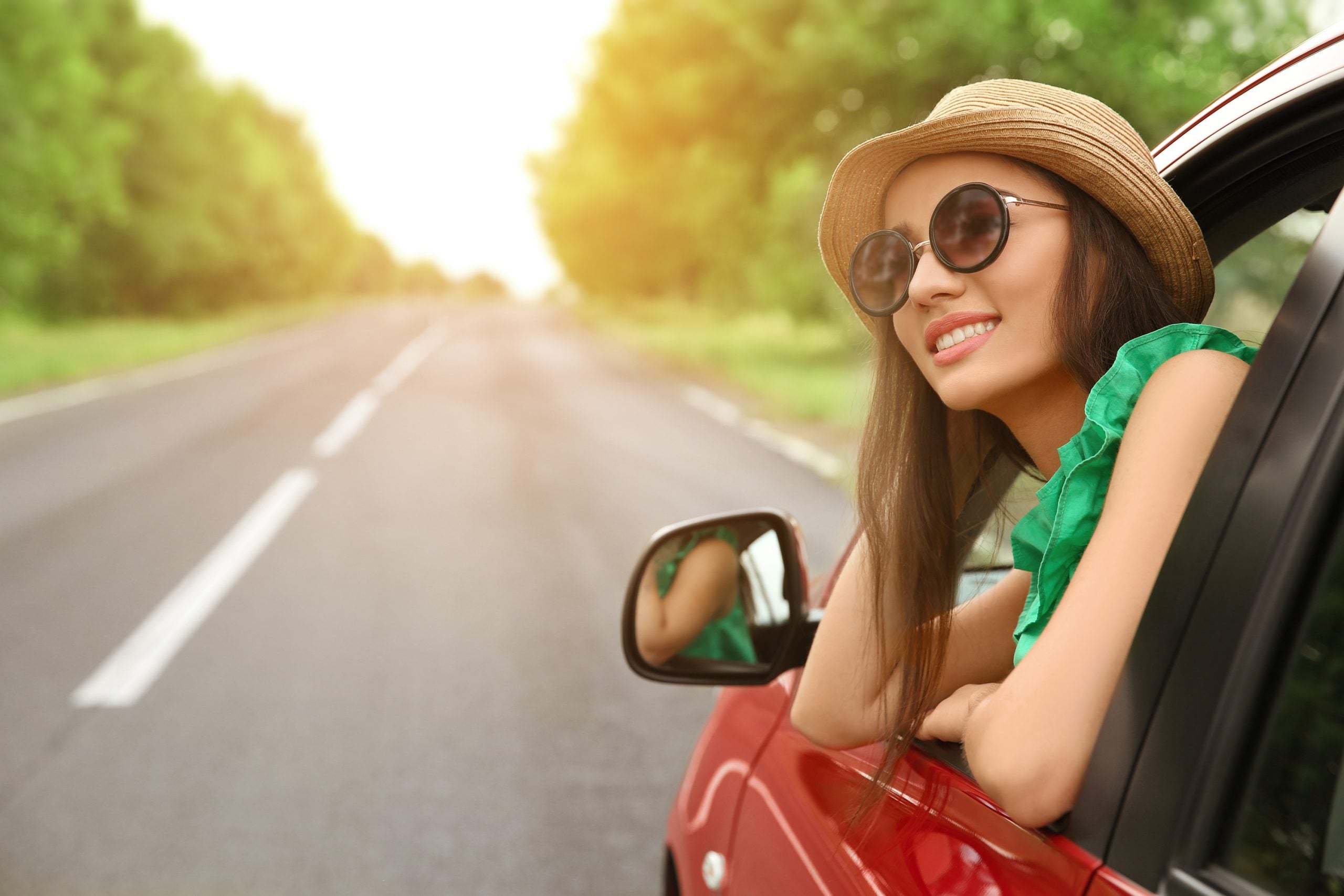Woman,Looking,Out,Of,Car,Window