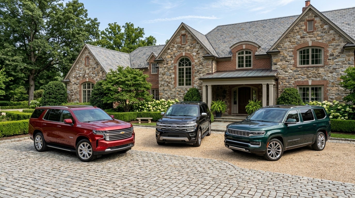 Red Chevrolet, black Ford, and green Jeep SUVs parked in front of a luxury stone mansion. (Representative image for illustration purposes only. Actual vehicle may vary based on trim and configuration.)